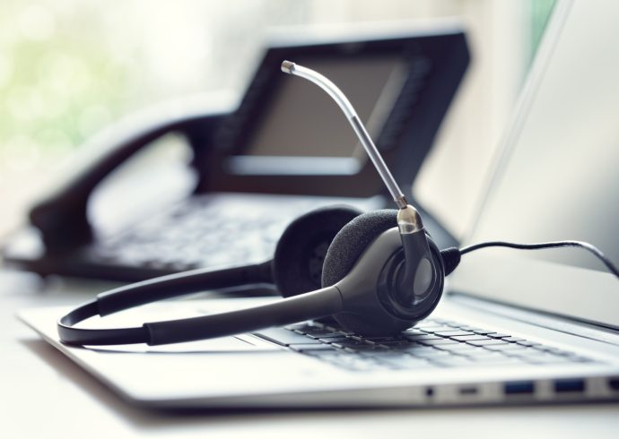 headset-headphones-telephone-and-laptop-in-call-center.jpg